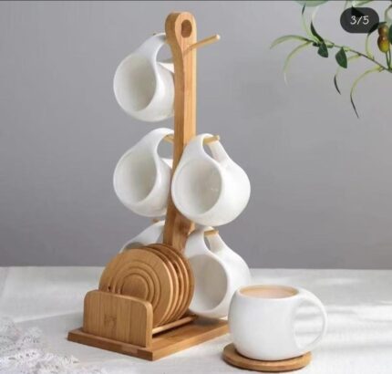 White ceramic cups with wooden bamboo stand